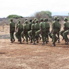 Community scouts train in a field