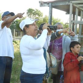 Macanao people participating in a birdwatching activity as part of the Green Sky campaign. Photo by Karelis Ramirez